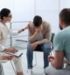 man feening for drugs during group therapy in Massachusetts