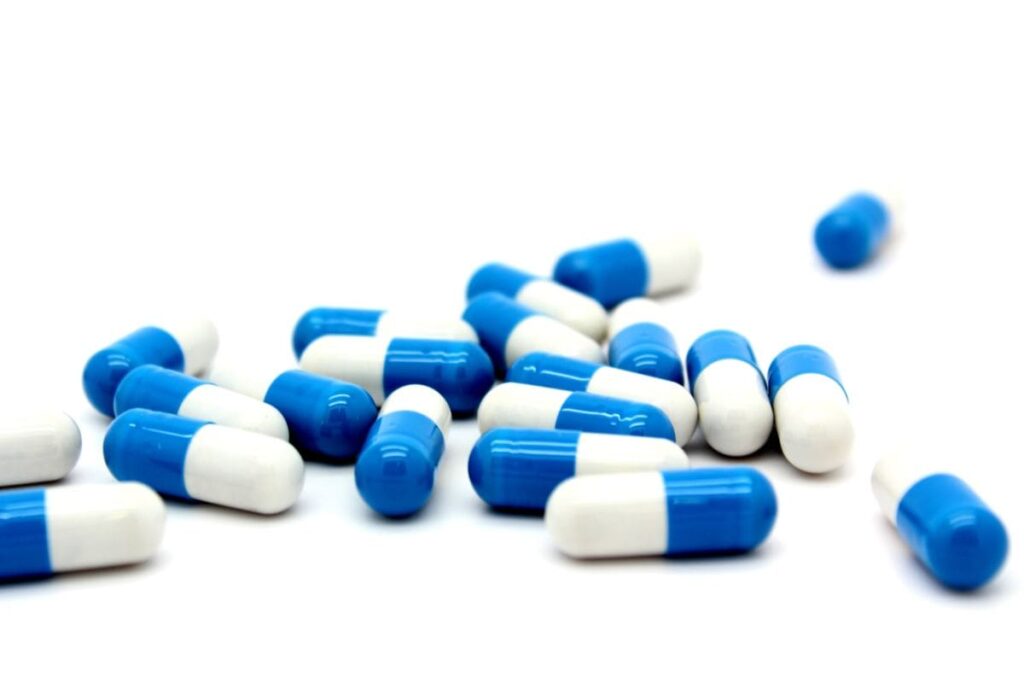 blue and white Vyvanse capsules