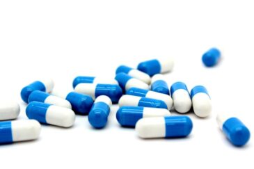 blue and white Vyvanse capsules