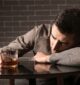man struggling with alcoholism drinks different types of liquor