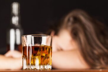 woman passes out from the depressant effects of alcohol