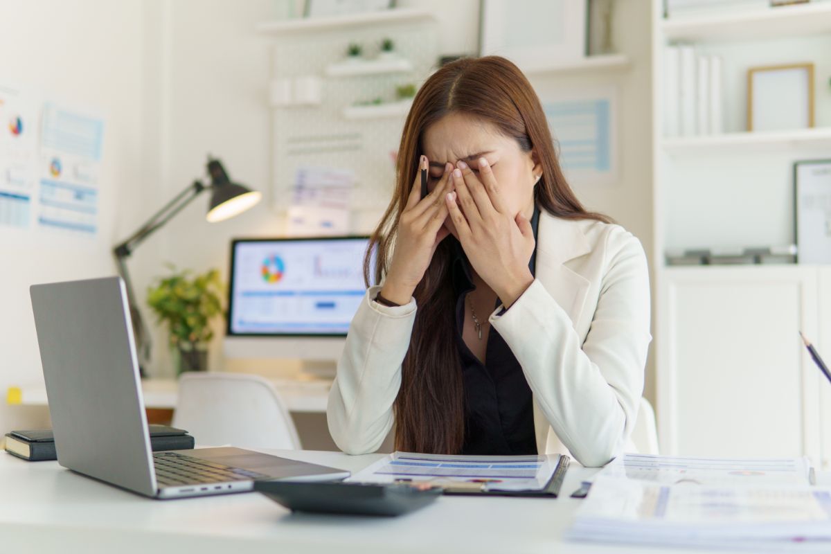 woman with high functioning depression feels stressed at work