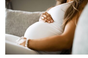 woman holding pregnant belly