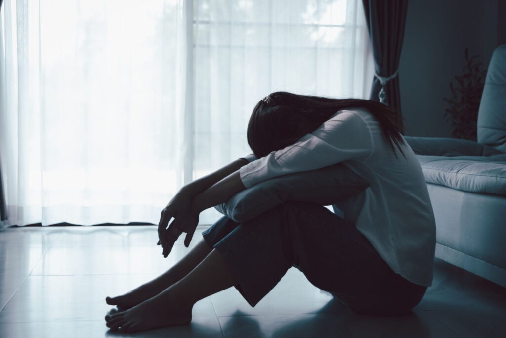 person addicted to fentanyl sits alone