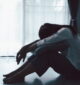 person addicted to fentanyl sits alone